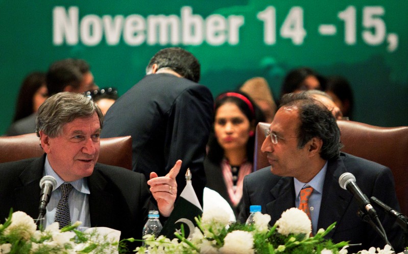 FILE PHOTO: U.S. Special Representative for Afghanistan & Pakistan Holbrooke co-chairs a session with Pakistan's Finance Minister Shaikh during the Pakistan Development Forum in Islamabad