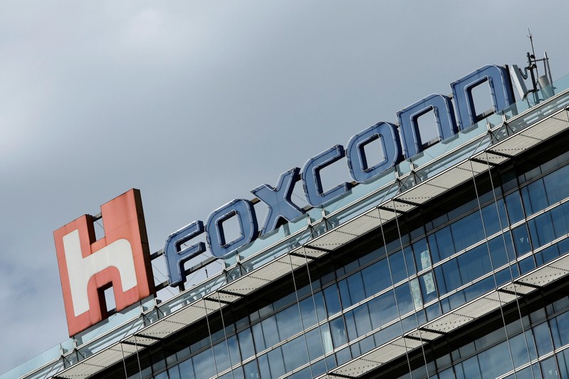 FILE PHOTO: The logo of Foxconn, the trading name of Hon Hai Precision Industry, is seen on top of the company's building in Taipei