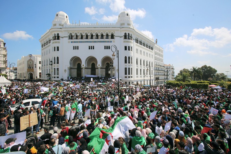 Students take part in a protest seeking the departure of the ruling elite in Algiers