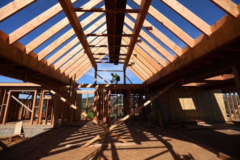 Construction worker builds a single family home in San Diego, California