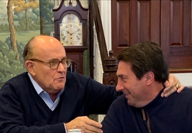 FILE PHOTO: U.S. President Donald Trump's lead attorneys Jay Sekulow and Rudy Giuliani react after the Special Counsel summary was released in Washington