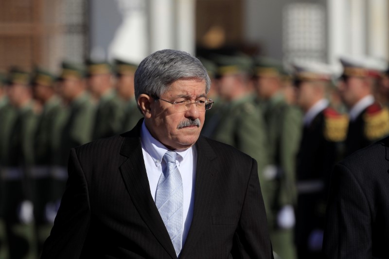 Algerian Prime Minister Ouyahia awaits arrival of French President Macron at Houari Boumediene airport in Algiers