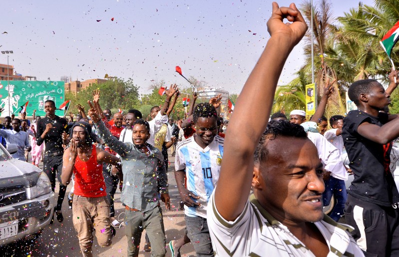FILE PHOTO - Sudanese demonstrators chant slogans along the streets in Khartoum