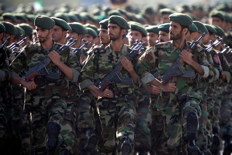 Members of Iran's Revolutionary Guards march during a military parade to commemorate the 1980-88 Iran-Iraq war in Tehran