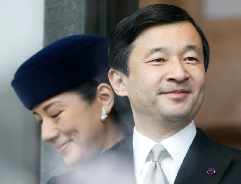 FILE PHOTO: Japan's Crown Prince Naruhito and Crown Princess Masako appear before well-wishers as they celebrate the emperor's 74th birthday in Tokyo