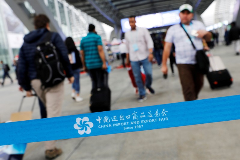 FILE PHOTO: Visitors attend the China Import and Export Fair, also known as Canton Fair, in the southern city of Guangzhou