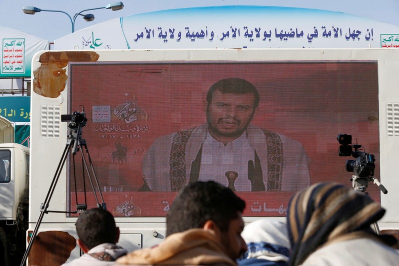 Leader of the Shi'ite Houthi movement, Abdul-Malik Badruddin al-Houthi, addresses supporters via a screen during a demonstration to mark the Ashura holy day in Sanaa