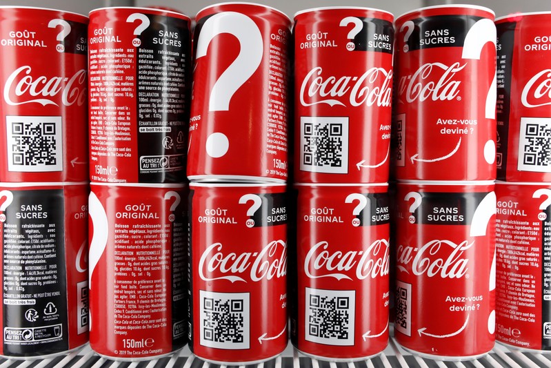 Cans of Coca-Cola are pictured in the refrigerator during an event in Paris