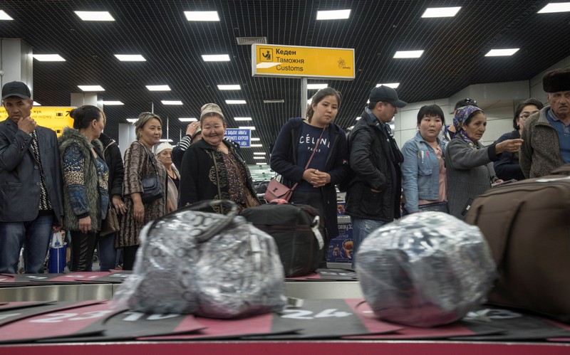 Passengers of a flight from Ashgabat gather at Almaty International Airport