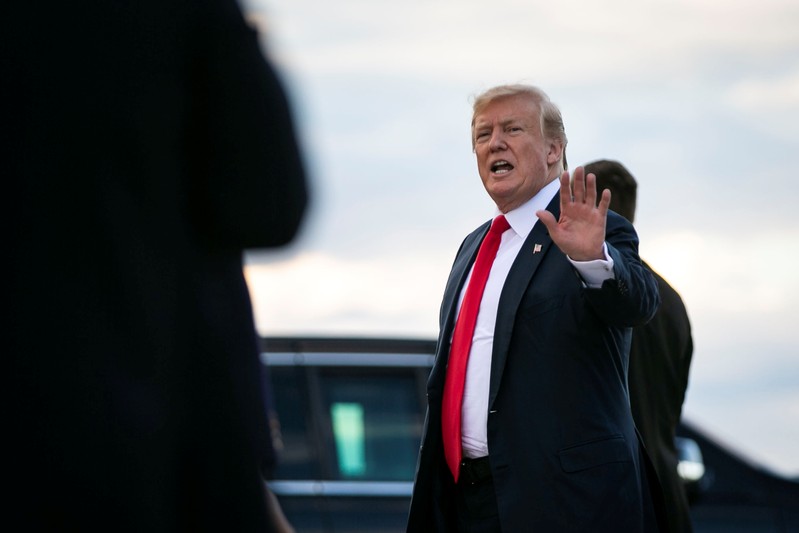 U.S. President Donald Trump and U.S. first lady Melania Trump arrive aboard Air Force One