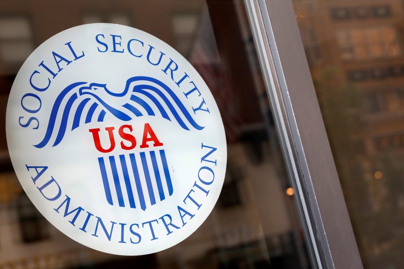 FILE PHOTO: Sign is seen on the entrance to a Social Security office in New York