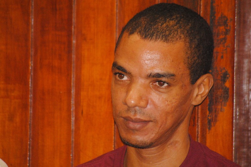Grant, a British citizen, sits inside the dock at the Law Courts in the Kenya's coastal city of Mombasa