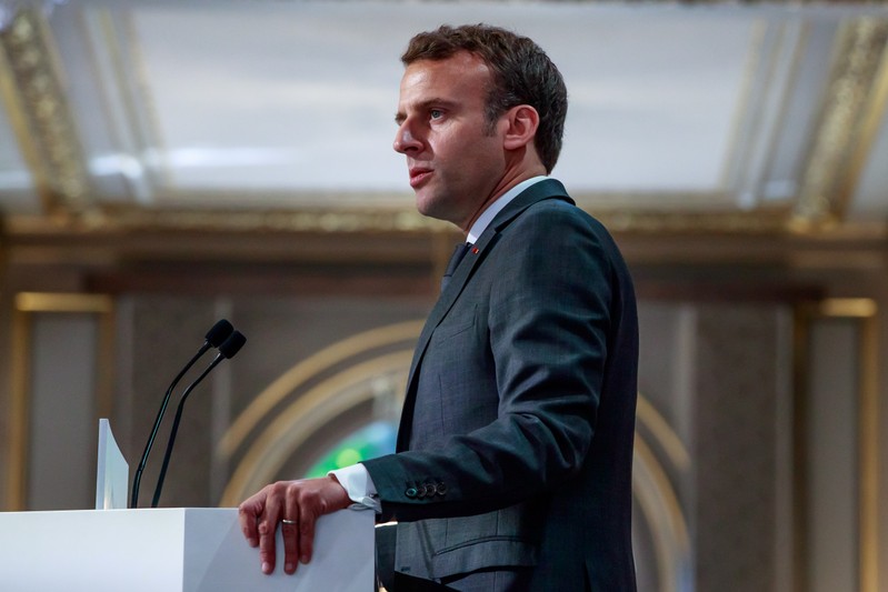 French President Emmanuel Macron delivers a speech for the Parisian Firefighters' brigade and security forces who took part at the fire extinguishing operations during the Notre Dame of Paris Cathedral fire, at Elysee Palace
