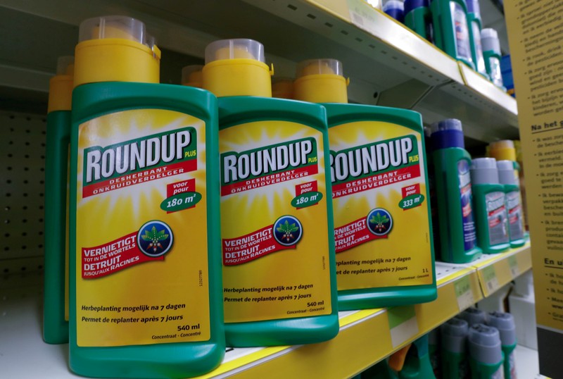 FILE PHOTO: Bayer's Roundup weed killer atomizers are displayed for sale at a garden shop near Brussels
