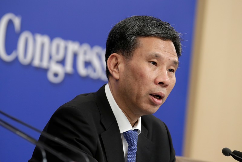 Chinese Finance Minister Liu Kun attends a news conference during the ongoing NPC in Beijing