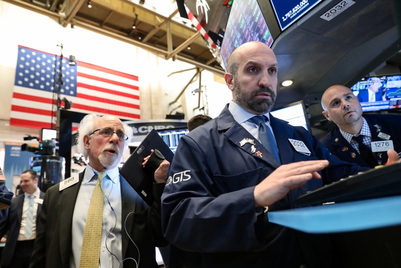 Traders work on the floor at the NYSE in New York