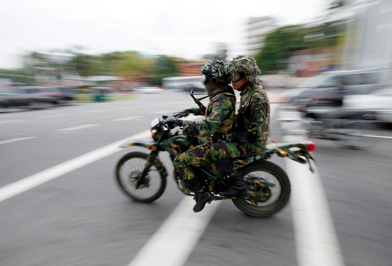 Sri Lankan Special Task Force soldiers are seen on patrol near a mosque during the Friday prayers, in Colombo