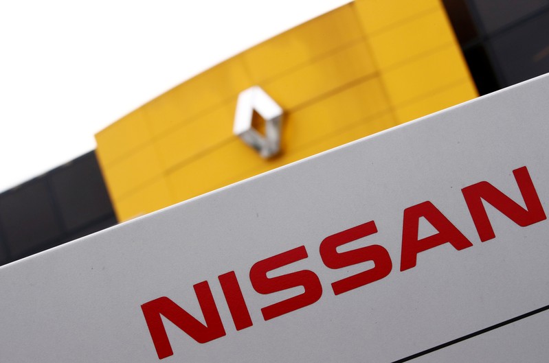 FILE PHOTO: The logos of car manufacturers Renault and Nissan are seen in front of a common dealership of the companies in Saint-Avold