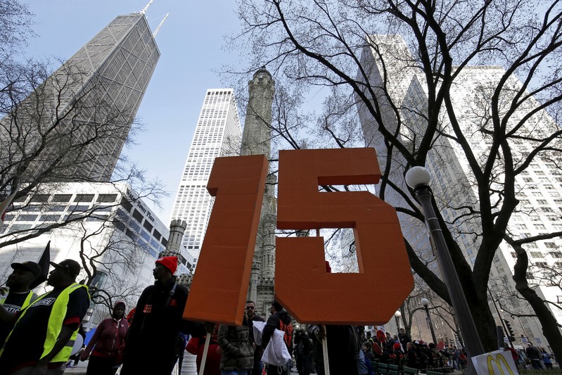FILE PHOTO: Demonstrators gather for a protest calling for a $15-an-hour nationwide minimum wage in downtown Chicago