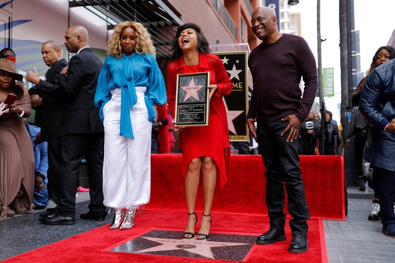 FILE PHOTO: Actor Taraji P. Henson poses with Mary J. Blige and director John Singleton after receiving a star on Hollywood's Walk of Fame in Los Angeles