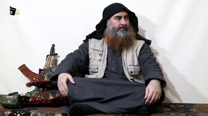 A bearded man with Islamic State leader Abu Bakr al-Baghdadi's appearance speaks in this screen grab taken from video
