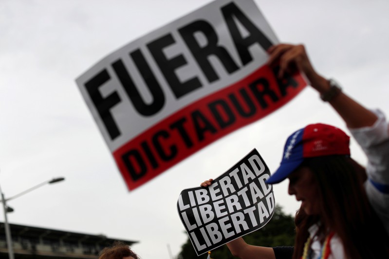 Supporters of Venezuelan opposition leader Juan Guaido, who many nations have recognized as the country's rightful interim ruler, take part in a protest in Panama City
