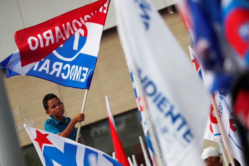 A supporter of PRD presidential candidate Cortizo attends an electoral campaign closing rally in Panama City