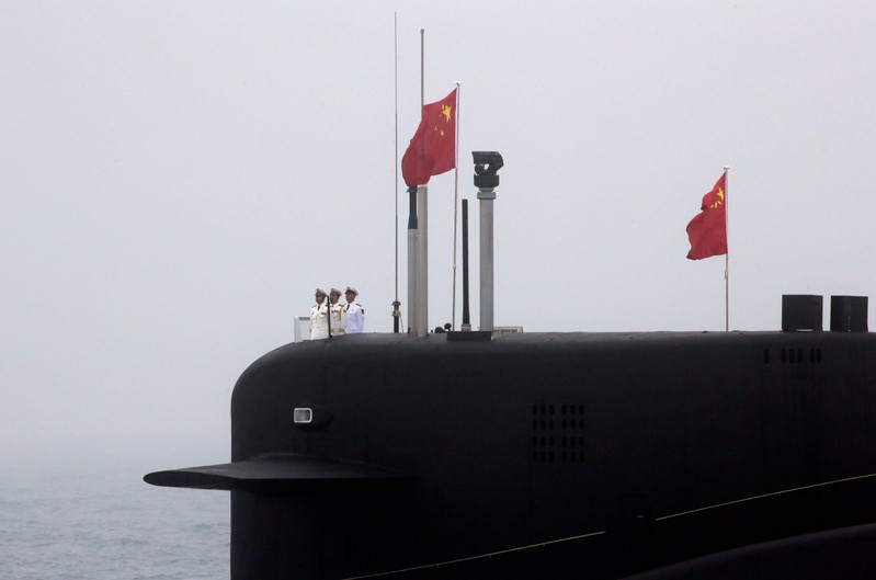 FILE PHOTO: Chinese Navy’s nuclear-powered submarine Long March 10 takes part in a naval parade off the eastern port city of Qingdao, to mark the 70th anniversary of the founding of Chinese People's Liberation Army Navy