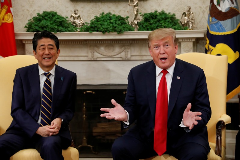 U.S. President Donald Trump meets with Japan's Prime Minister Shinzo Abe in the Oval Office at the White House in Washington