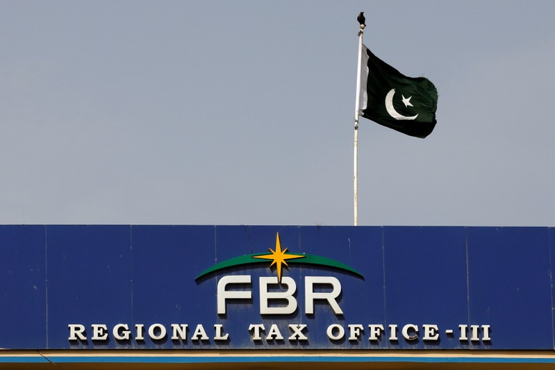 FILE PHOTO: The national flag is seen on the Federal Board of Revenue (FBR) office building in Karachi