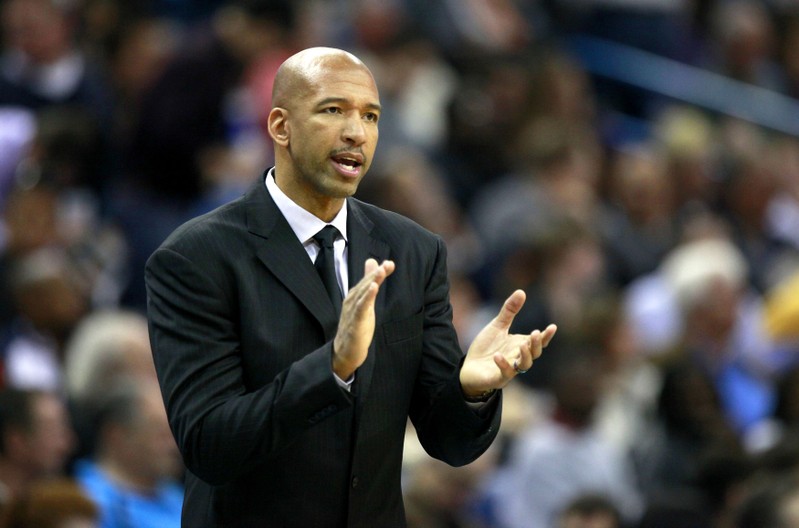FILE PHOTO - New Orleans Hornets head coach Williams encourages his team as they take on the Chicago Bulls during second half NBA game in New Orleans, Louisiana