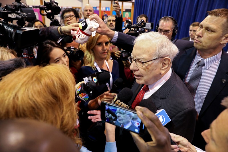 Berkshire Hathaway Chairman Warren Buffett walks through the exhibit hall as shareholders gather to hear from the billionaire investor at Berkshire Hathaway Inc's annual shareholder meeting in Omaha