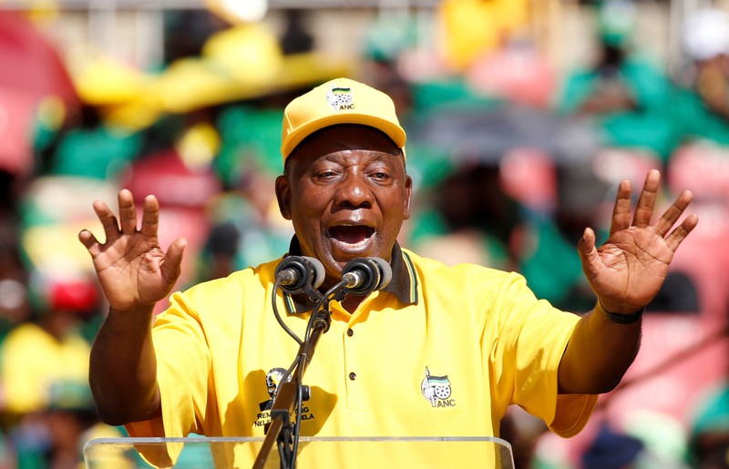 President of South Africa's governing African National Congress Cyril Ramaphosa waves to his supporters, as he arrives for the party's final rally at Ellis Park Stadium in Johannesburg