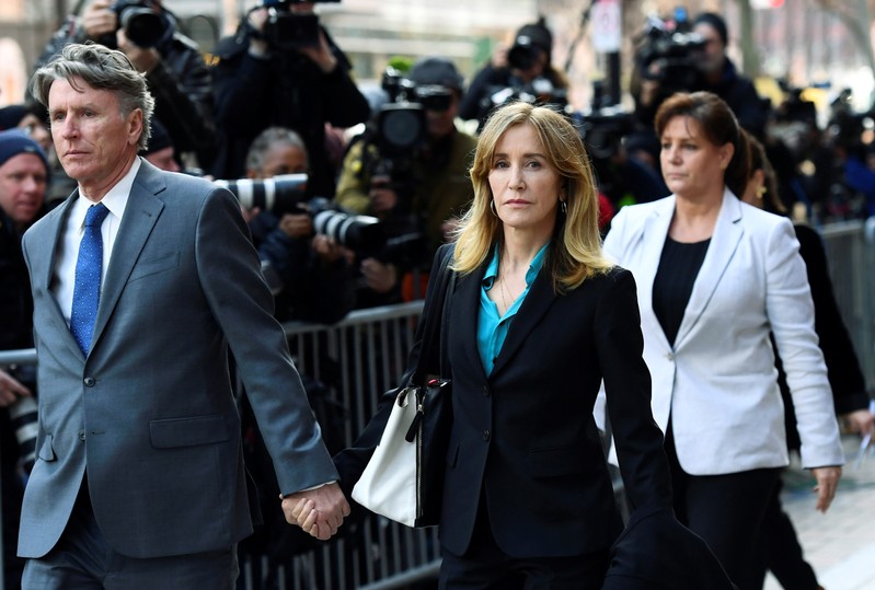 FILE PHOTO - Actor Felicity Huffman leaves the federal courthouse after facing charges in a nationwide college admissions cheating scheme in Boston