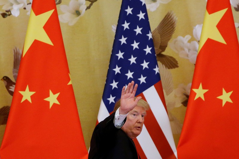 FILE PHOTO: U.S. President Donald Trump and China's President Xi Jinping make joint statements at the Great Hall of the People in Beijing