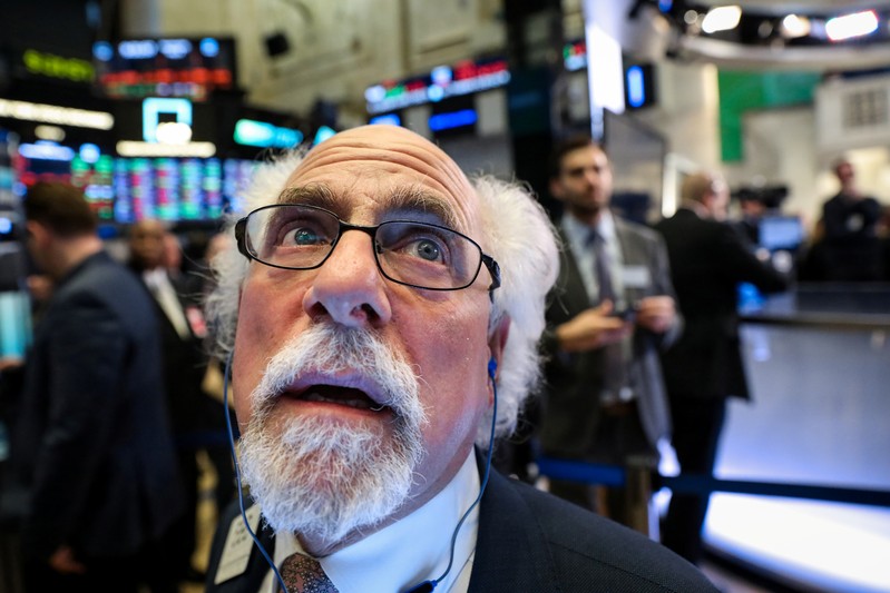 Traders work on the floor at the NYSE in New York