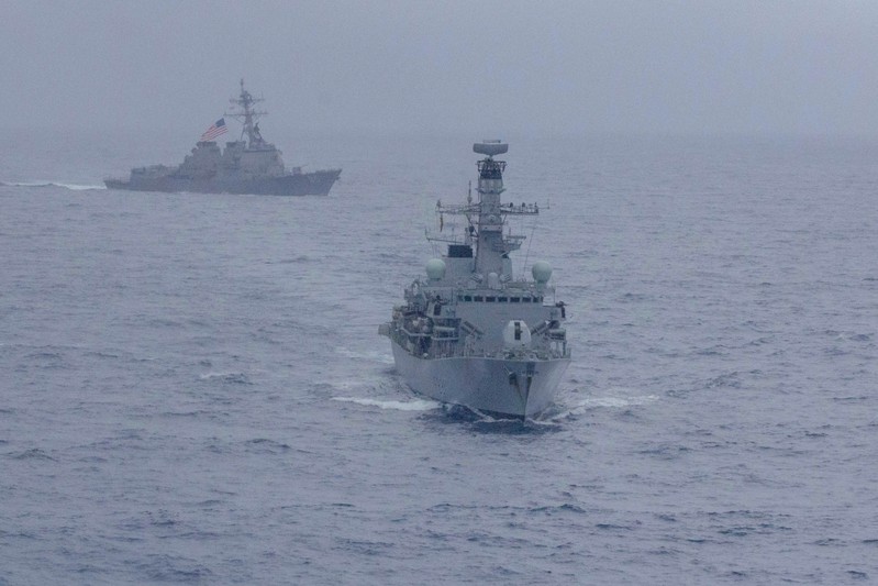 U.S. Navy handout photo of the Arleigh Burke-class guided-missile destroyer USS McCampbell and the Royal Navy Type 23 ‘Duke’ Class guided-missile frigate HMS Argyll in the South China Sea
