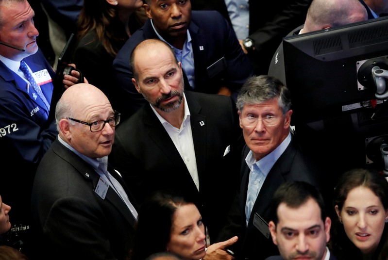 Uber Technologies Inc. CEO Dara Khosrowshahi, Chairman Ronald Sugar and board member John Thain on trading floor of NYSE during the company's IPO in New York