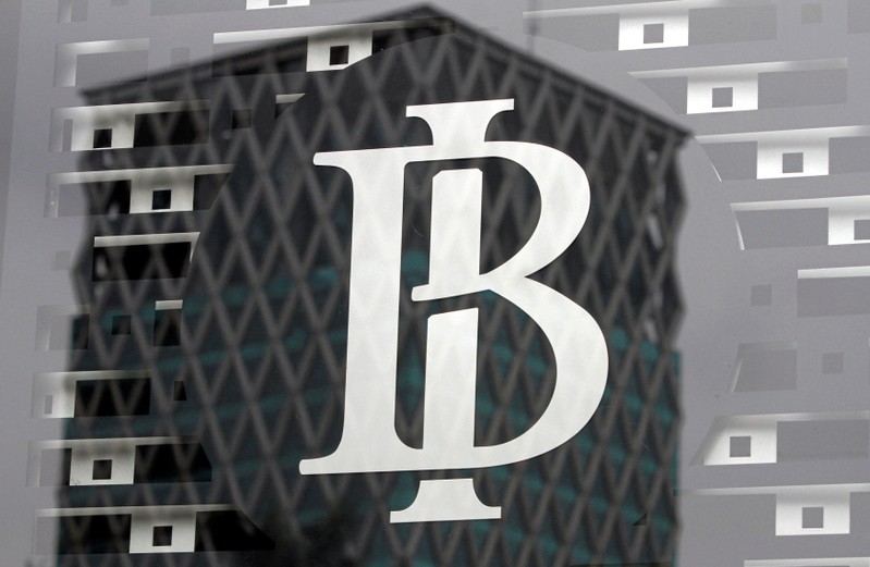 FILE PHOTO: The logo of Indonesia's central bank, Bank Indonesia, is seen on a window in the bank's lobby in Jakarta, Indonesia