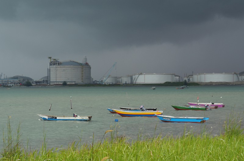 FILE PHOTO: Boats float in front of the VOPAK oil storage terminal in Johor
