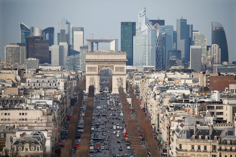 FILE PHOTO: General view of the skyline of La Defense business district with its Arche behind Paris' landmark, the Arc de Triomphe and the Champs Elysees avenue in Paris