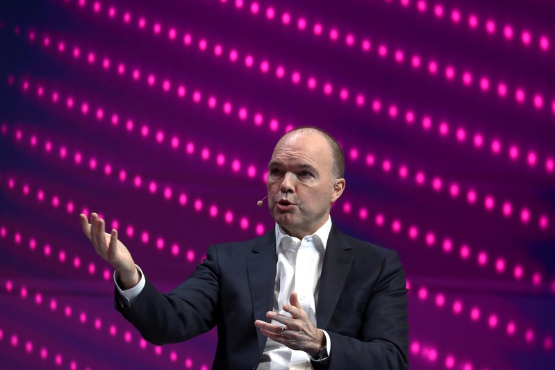 FILE PHOTO: Nick Read, CEO of Vodafone, gestures as he speaks during the Mobile World Congress in Barcelona