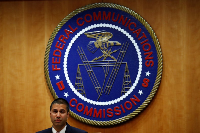 FILE PHOTO: Chairman Ajit Pai speaks ahead of the vote on the repeal of so called net neutrality rules at the Federal Communications Commission in Washington