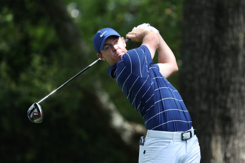 FILE PHOTO: Rory McIlroy of Northern Ireland hits off the second tee during first round play of the 2019 Master golf tournament at Augusta National Golf Club in Augusta, Georgia, U.S.