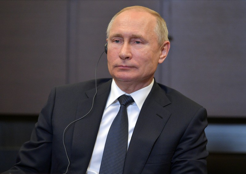 FILE PHOTO: Russian President Vladimir Putin attends a meeting with Chinese Foreign Minister Wang Yi at the Bocharov Ruchei residence in Sochi