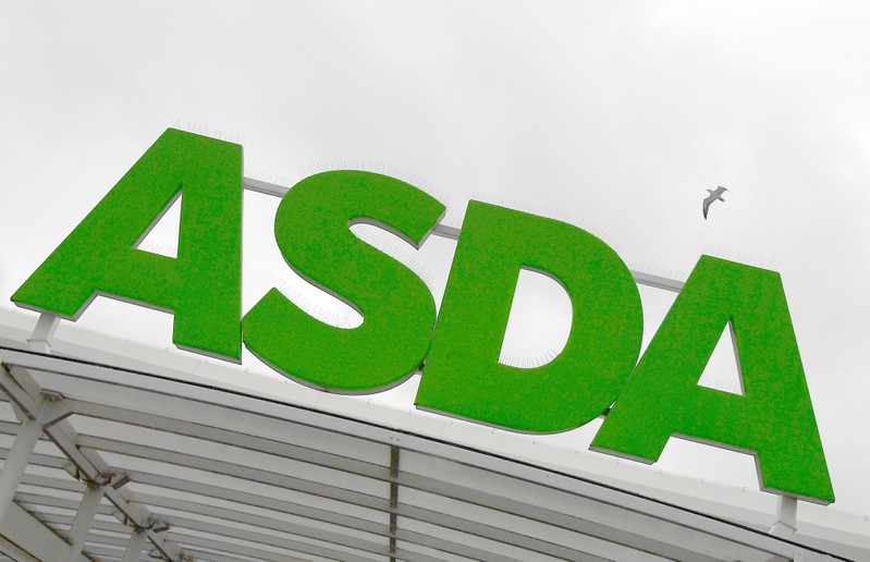 A gull flies near an Asda store in west London, Britain