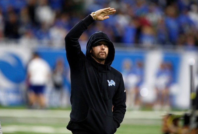 FILE PHOTO: American rapper Marshall Mathers, professionally known as Eminem, reacts as he walks off the field after a pre-game coin toss between the Detroit Lions and the New York Jets before their NFL game in Detroit, Michigan