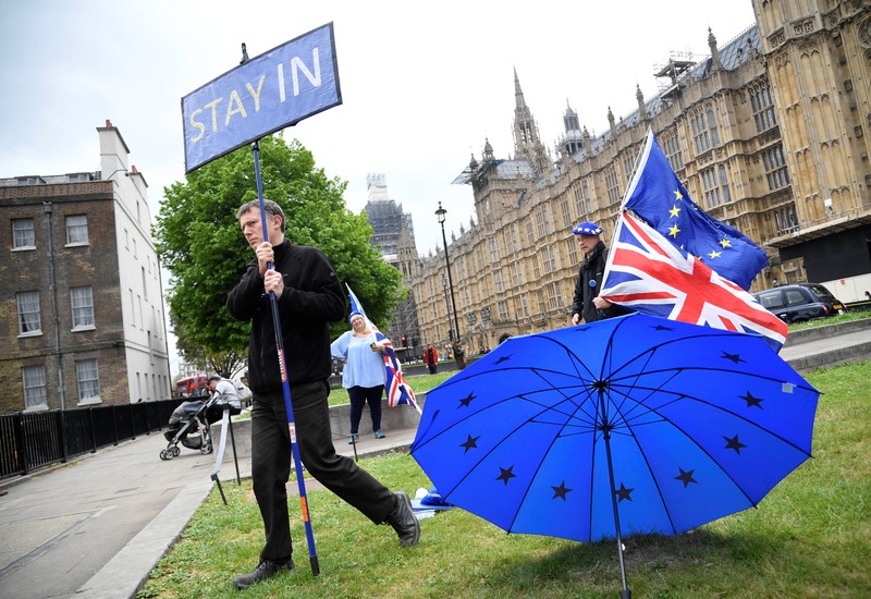 Anti-Brexit protesters are seen near the Houses of Parliament in London