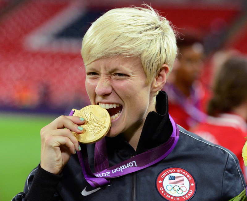 FILE PHOTO: Rapinoe of the U.S. celebrates after defeating Japan in the women's final soccer match at the London 2012 Olympic Games in London at Wembley Stadium