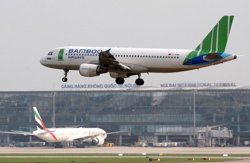 FILE PHOTO: A Bamboo Airways Airbus A320 plane prepares to land at Noi Bai international airport in Hanoi